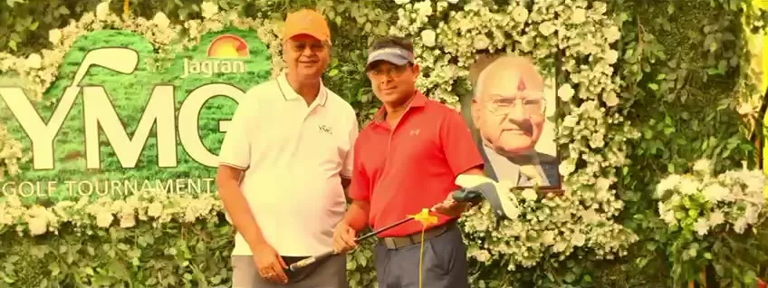 Prize presentation in front of the YMG backdrop
