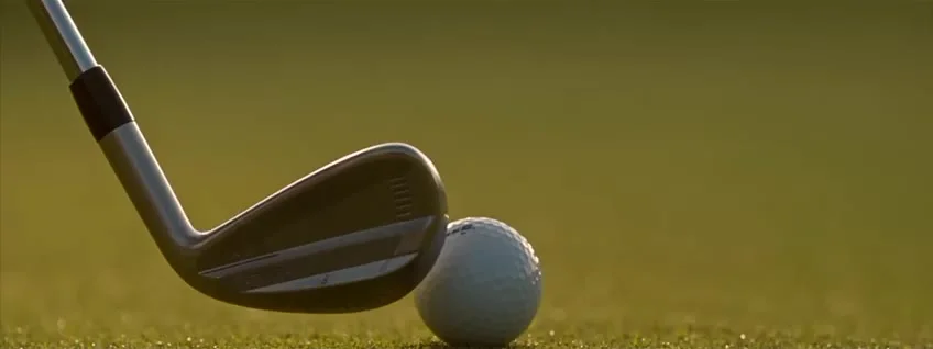 Golf iron and ball